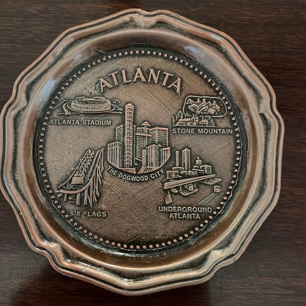 Vintage bronze-colored Atlanta coaster